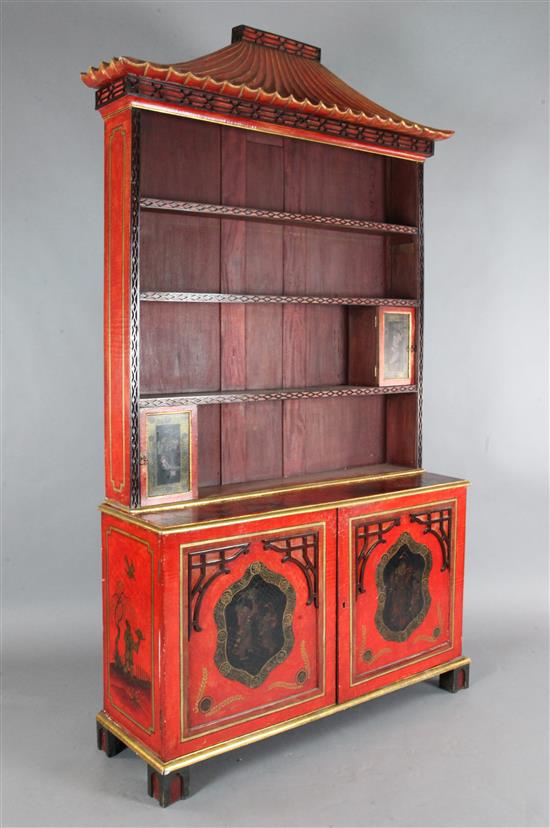 A Chinese Chippendale style red lacquered bookcase, W.4ft 6in. H.7ft 6in.